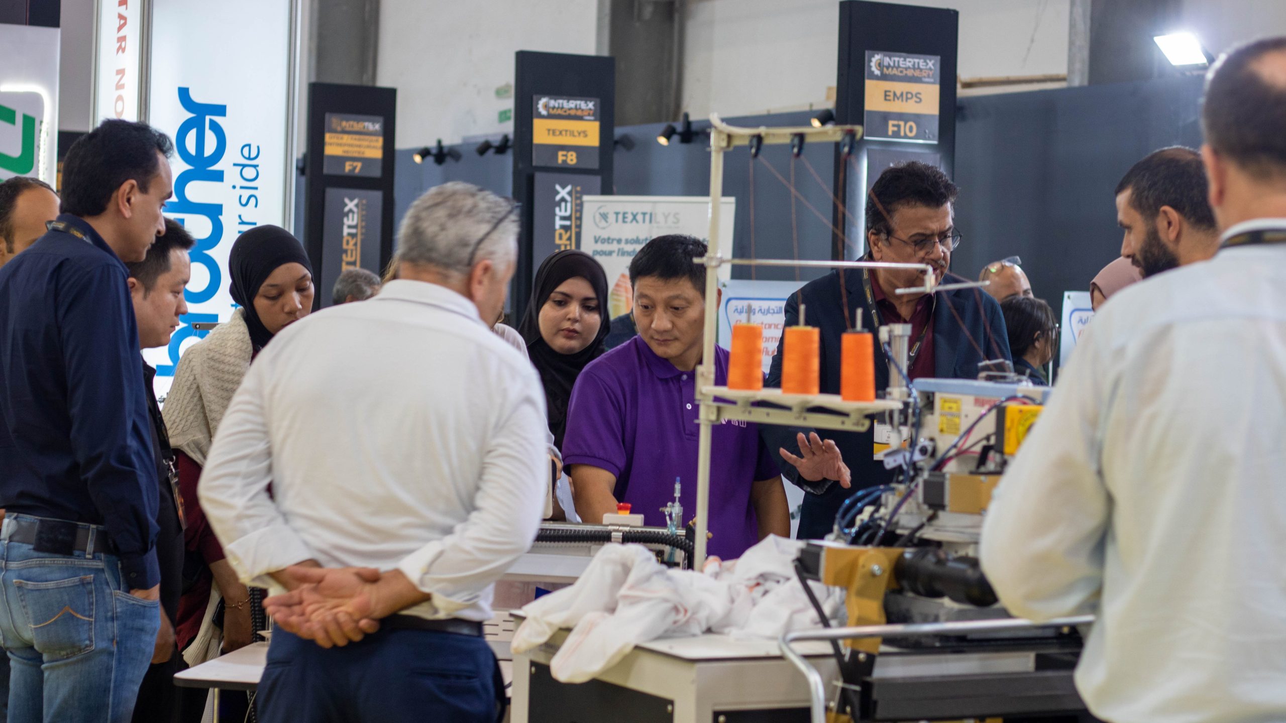 Visitors in the Tunisian exhibition, lloking at the exhibitor stands.